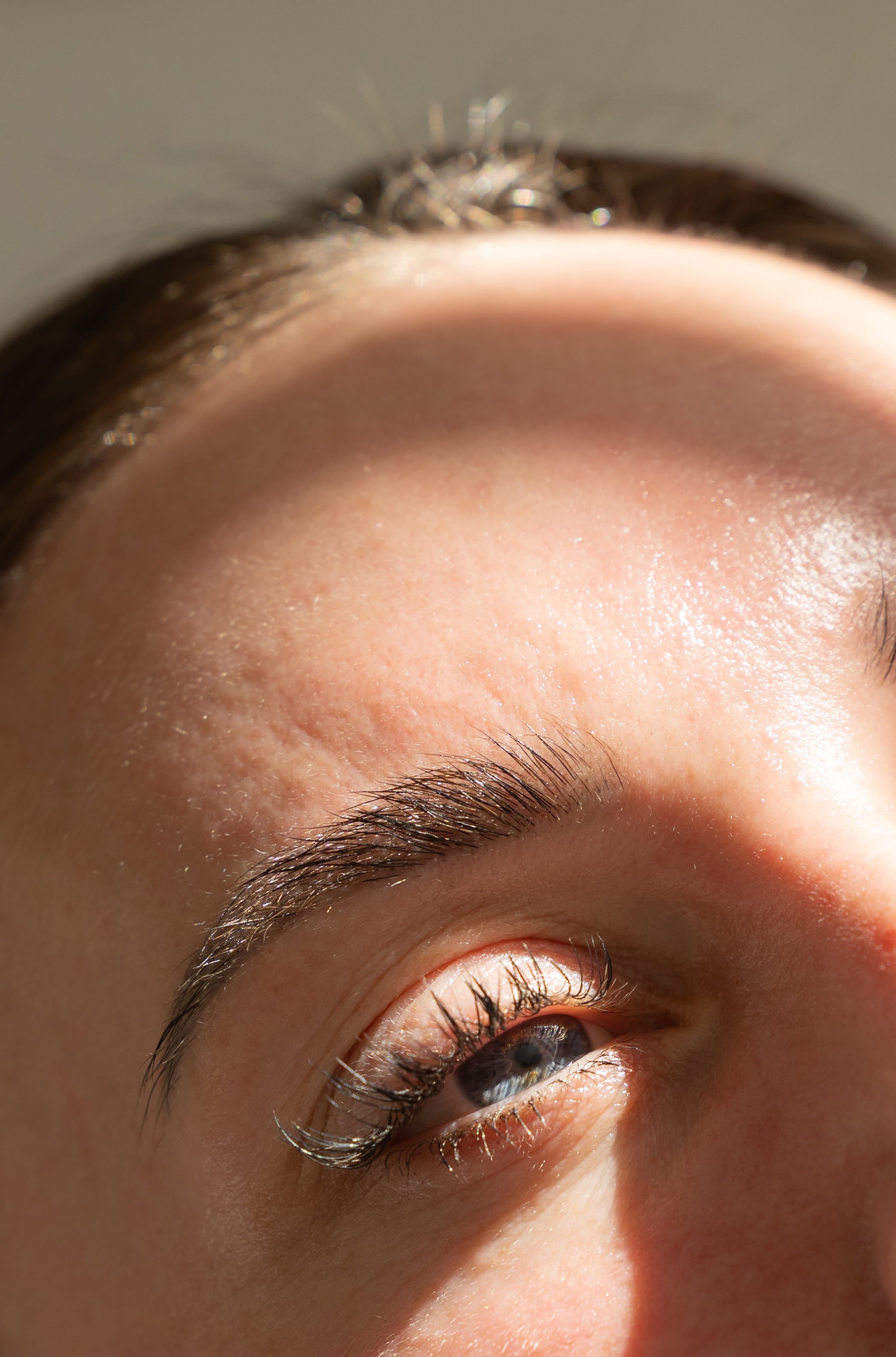 Close-up of a person's eye with a neutral background