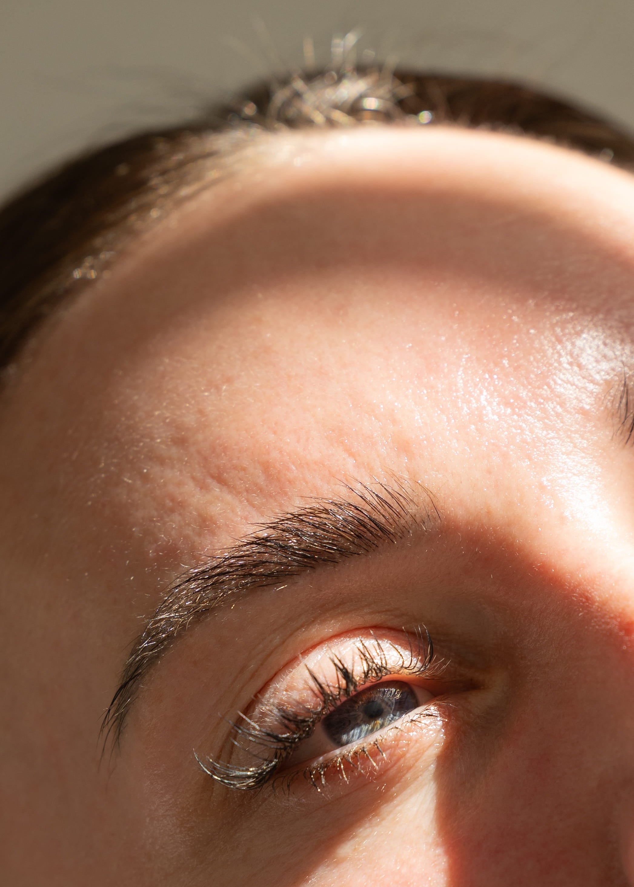 Close-up of a person's eye with a neutral background
